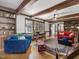 Spacious living room with exposed wood beams, hardwood floors, and built in shelving at 806 S First St, Smithfield, NC 27577