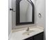 Bathroom featuring black hardware, a custom mirror, and neutral walls at 8700 Leeds Forest Ln, Raleigh, NC 27615