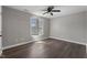 Neutral bedroom featuring hardwood floors, natural light, and neutral walls at 8700 Leeds Forest Ln, Raleigh, NC 27615