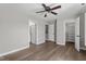 Spacious bedroom featuring hardwood floors, natural light, and ample closet space at 8700 Leeds Forest Ln, Raleigh, NC 27615