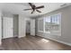 This bright bedroom offers hardwood floors and large windows, perfect for relaxing at 8700 Leeds Forest Ln, Raleigh, NC 27615