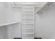 Walk-in closet with built-in shelving provides ample storage space at 8700 Leeds Forest Ln, Raleigh, NC 27615