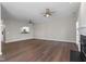The airy living room offers hardwood floors, a fireplace, and a kitchen view at 8700 Leeds Forest Ln, Raleigh, NC 27615
