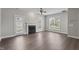 Bright living room with fireplace and hardwood floors, perfect for relaxing or entertaining at 8700 Leeds Forest Ln, Raleigh, NC 27615