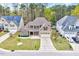 Aerial view of a two-story home with a driveway and two car garage at 8932 Buffalo Gourd Ln, Angier, NC 27501