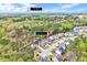 Aerial view shows the location of 8932 Buffalo Gourd Ln within the surrounding wooded community, close to Fuquay-Varina at 8932 Buffalo Gourd Ln, Angier, NC 27501