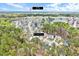 Aerial view shows the location of 8932 Buffalo Gourd Ln within the surrounding wooded community, close to Raleigh at 8932 Buffalo Gourd Ln, Angier, NC 27501