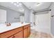 This bathroom offers a double sink vanity with tub and shower combo at 8932 Buffalo Gourd Ln, Angier, NC 27501