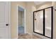 Bathroom with shower area and tile flooring, including a view into the walk-in closet at 8932 Buffalo Gourd Ln, Angier, NC 27501