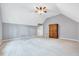 This bedroom features neutral walls and carpeting with a unique armoire at 8932 Buffalo Gourd Ln, Angier, NC 27501