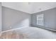 This bedroom boasts neutral walls and carpeting with a view from the window at 8932 Buffalo Gourd Ln, Angier, NC 27501