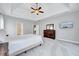 Spacious bedroom features trey ceilings, a ceiling fan, and neutral colors at 8932 Buffalo Gourd Ln, Angier, NC 27501