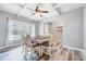 Naturally lit dining room featuring hardwood floors, a dining table and lots of light at 8932 Buffalo Gourd Ln, Angier, NC 27501
