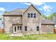 Exterior elevation of home with an expansive backyard at 8932 Buffalo Gourd Ln, Angier, NC 27501