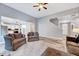 Open living room with hardwood floors and access to the kitchen at 8932 Buffalo Gourd Ln, Angier, NC 27501