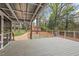 Relaxing backyard deck showcasing the lush landscape and a charming outbuilding at 927 Ferncrest Dr, Durham, NC 27705