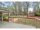 Inviting backyard deck offers scenic views of the landscaped yard and outbuilding at 927 Ferncrest Dr, Durham, NC 27705