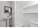 Small bathroom with standing sink, a tiled stand up shower, and vinyl flooring at 927 Ferncrest Dr, Durham, NC 27705
