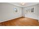 Bright and airy bedroom with hardwood floors, ample natural light, and closet at 927 Ferncrest Dr, Durham, NC 27705