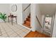 Sunlit entryway featuring tile floors and wood stairs at 927 Ferncrest Dr, Durham, NC 27705