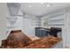 Galley-style kitchen featuring wood countertops, blue cabinets, stainless steel sink and open shelving at 927 Ferncrest Dr, Durham, NC 27705