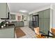 Spacious kitchen featuring stainless steel appliances, plenty of cabinet space, and a cozy dining area at 927 Ferncrest Dr, Durham, NC 27705