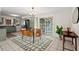 Eat-in kitchen with modern cabinets, stainless steel appliances, and a sliding glass door to the backyard at 927 Ferncrest Dr, Durham, NC 27705