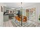 Bright eat-in kitchen with stainless appliances, sliding glass doors, and a modern light fixture at 927 Ferncrest Dr, Durham, NC 27705