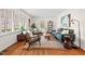 Bright living room featuring hardwood floors, a large window, and tastefully coordinated modern furniture at 927 Ferncrest Dr, Durham, NC 27705