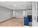Bright living room features modern track lighting, vinyl flooring, and a kitchen area at 927 Ferncrest Dr, Durham, NC 27705