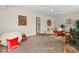 This living room features carpeted floors and a sitting area at 927 Ferncrest Dr, Durham, NC 27705
