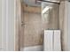 Inviting bathroom shower with tiled walls, glass door, and modern fixtures for comfort at 927 Ferncrest Dr, Durham, NC 27705