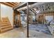 Exposed basement features wooden beams, stairs, and mechanicals at 102 Swallow Hill Ct, Cary, NC 27513