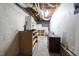 Unfinished basement with exposed ceiling, shelving, and concrete walls, offering potential for customization at 102 Swallow Hill Ct, Cary, NC 27513