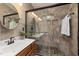 Elegant bathroom with walk-in shower featuring glass doors and a tiled surround at 102 Swallow Hill Ct, Cary, NC 27513