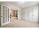 Spacious bonus room with plush carpeting and double French doors leading to the Primary at 102 Swallow Hill Ct, Cary, NC 27513
