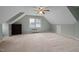 Spacious bonus room with unique ceiling, a window, and neutral carpet at 102 Swallow Hill Ct, Cary, NC 27513