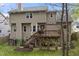 Rear view of home featuring a deck, walkout basement, neutral siding, and mature trees at 102 Swallow Hill Ct, Cary, NC 27513