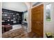 Inviting home office with custom built-in bookshelves and wood-look flooring at 102 Swallow Hill Ct, Cary, NC 27513