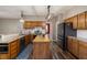 Charming kitchen with wood cabinets, large island, and stainless-steel appliances at 102 Swallow Hill Ct, Cary, NC 27513