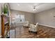 Cozy living room with fireplace, ceiling fan and wood floor at 102 Swallow Hill Ct, Cary, NC 27513