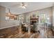 Comfortable living room with fireplace open to kitchen, perfect for entertaining at 102 Swallow Hill Ct, Cary, NC 27513