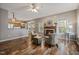 Comfortable living room with fireplace open to kitchen, perfect for entertaining at 102 Swallow Hill Ct, Cary, NC 27513