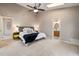 Spacious main bedroom with neutral tones, ceiling fan, and an attached bathroom at 102 Swallow Hill Ct, Cary, NC 27513