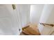 Stairway to basement featuring hardwood treads at 102 Swallow Hill Ct, Cary, NC 27513