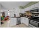 Kitchen featuring stainless steel appliances, tile floors and bar top at 103 Friar Ln, Carrboro, NC 27510