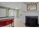 View of kitchen with tile floors adjacent to dining area and living room at 103 Friar Ln, Carrboro, NC 27510