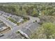 An aerial view of a quiet neighborhood of townhomes nestled amongst mature trees at 111 Wards Ridge Dr, Cary, NC 27513