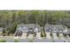 Charming townhomes with garages and manicured lawns surrounded by a lush green forest at 111 Wards Ridge Dr, Cary, NC 27513