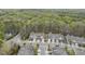 An overhead view of quaint townhomes in a neighborhood, lined with sidewalks and trees at 111 Wards Ridge Dr, Cary, NC 27513
